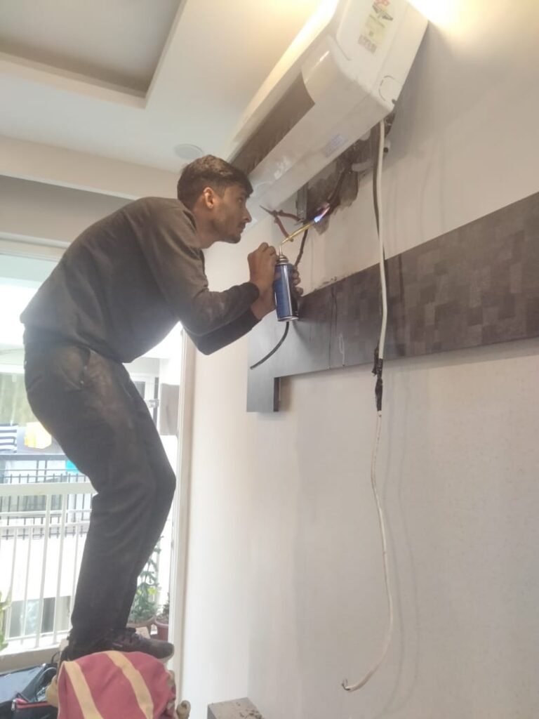 split ac installation by expert technician of repair guru service, split ac indoor unit installation